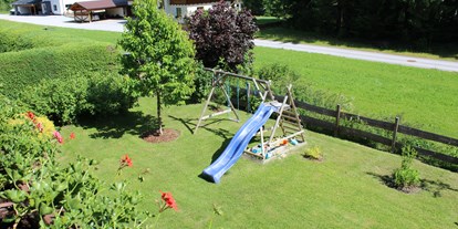 Hundehotel - Umgebungsschwerpunkt: Berg - Steiermark - Garten komplett eingezäunt - Appartement Kachelofenzauber- Sandkiste - Spielturm - Griller - Appartement Mama