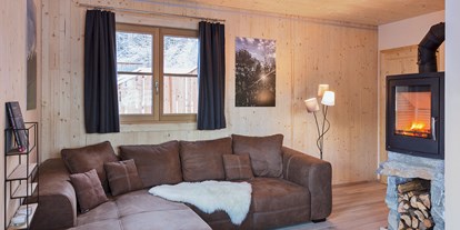 Hundehotel - WLAN - PLZ 8854 (Österreich) - Wohnzimmer mit Kamin - Ferienhäuser Gerhart