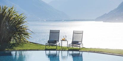 Hundehotel - Umgebungsschwerpunkt: See - PLZ 6614 (Schweiz) - Aussicht vom Pool über den Lago Maggiore - Parkhotel Brenscino Brissago