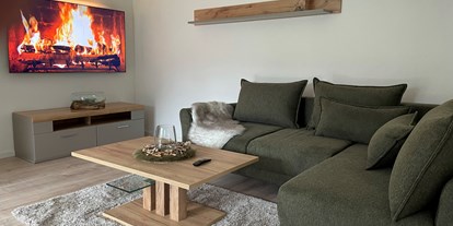 Hundehotel - Unterkunftsart: Einzelhaus - Kuschelsofa und 65 Zoll TV mit Netflix - Wellness Ferienhaus Bergheide