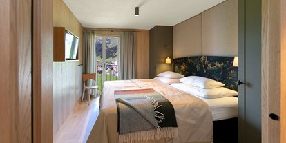 Hundehotel - Preisniveau: moderat - PLZ 7231 (Schweiz) - Zimmer im alpinen Stil - Hotel Schranz 