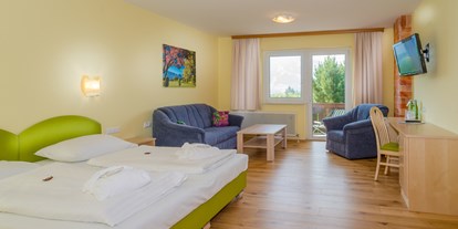 Hundehotel - Unterkunftsart: Appartement - PLZ 5452 (Österreich) - Geräumige, hundefreundliche Zimmer mit Balkon - Almfrieden Hotel & Romantikchalet
