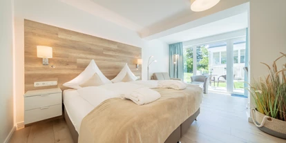 Hundehotel - Doggies: 3 Doggies - Bastorf - Juniorsuite Garten im EG - HofHotel Krähenberg