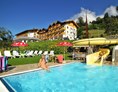Urlaub-mit-Hund: Freibad mit Wasserrutsche - Hotel Glocknerhof