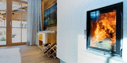 Hundehotel - in einer Ferienanlage/Wohnanlage - Großarl - Kamin im Wohnraum vom Birnbaum Chalet Fulseck und Kreuzkogel - Birnbaum Chalets