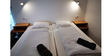 Hundehotel - PLZ 5102 (Österreich) - Schlafzimmer - Vianova Lodges & Geinberg Suites