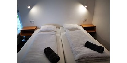 Hundehotel - PLZ 5321 (Österreich) - Schlafzimmer - Vianova Lodges & Geinberg Suites