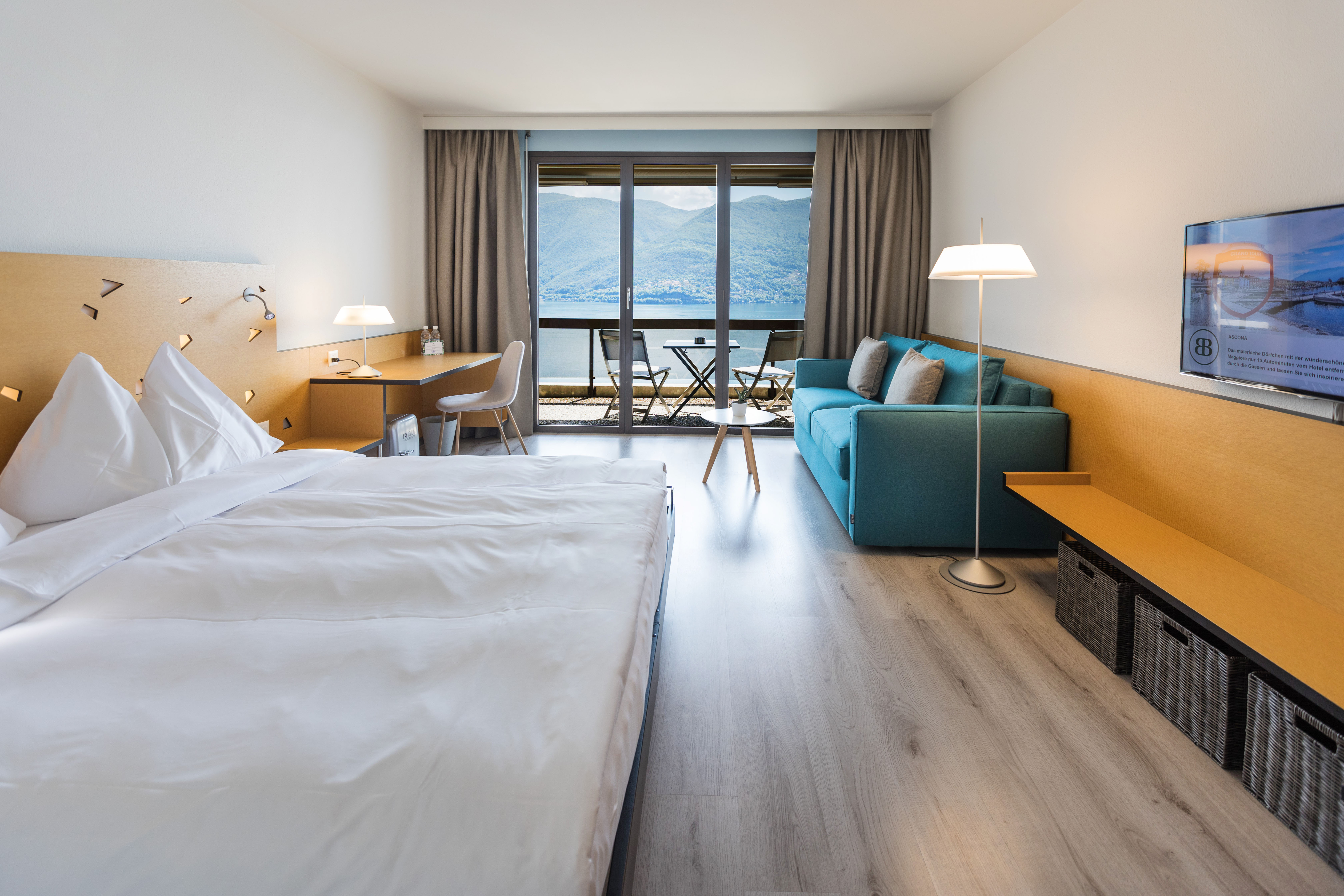 Urlaub-mit-Hund: Large Premium mit Balkon und Seesicht - Parkhotel Brenscino Brissago - Wohnen | Schlafen