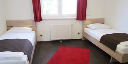 Hundehotel - Frühstück - Premiumhaus Einzelbettzimmer - Premiumhaus in Damp