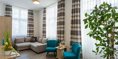Hundehotel - Ladestation Elektroauto - Dipperz - Wohnbereich Juniorsuite - Boutique Hotel Badehof