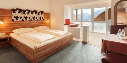 Hundehotel - Ofterschwang - PanoramaSuite mit schönem Bild und großen Glasfronten - Panoramahotel Talhof Garni & more